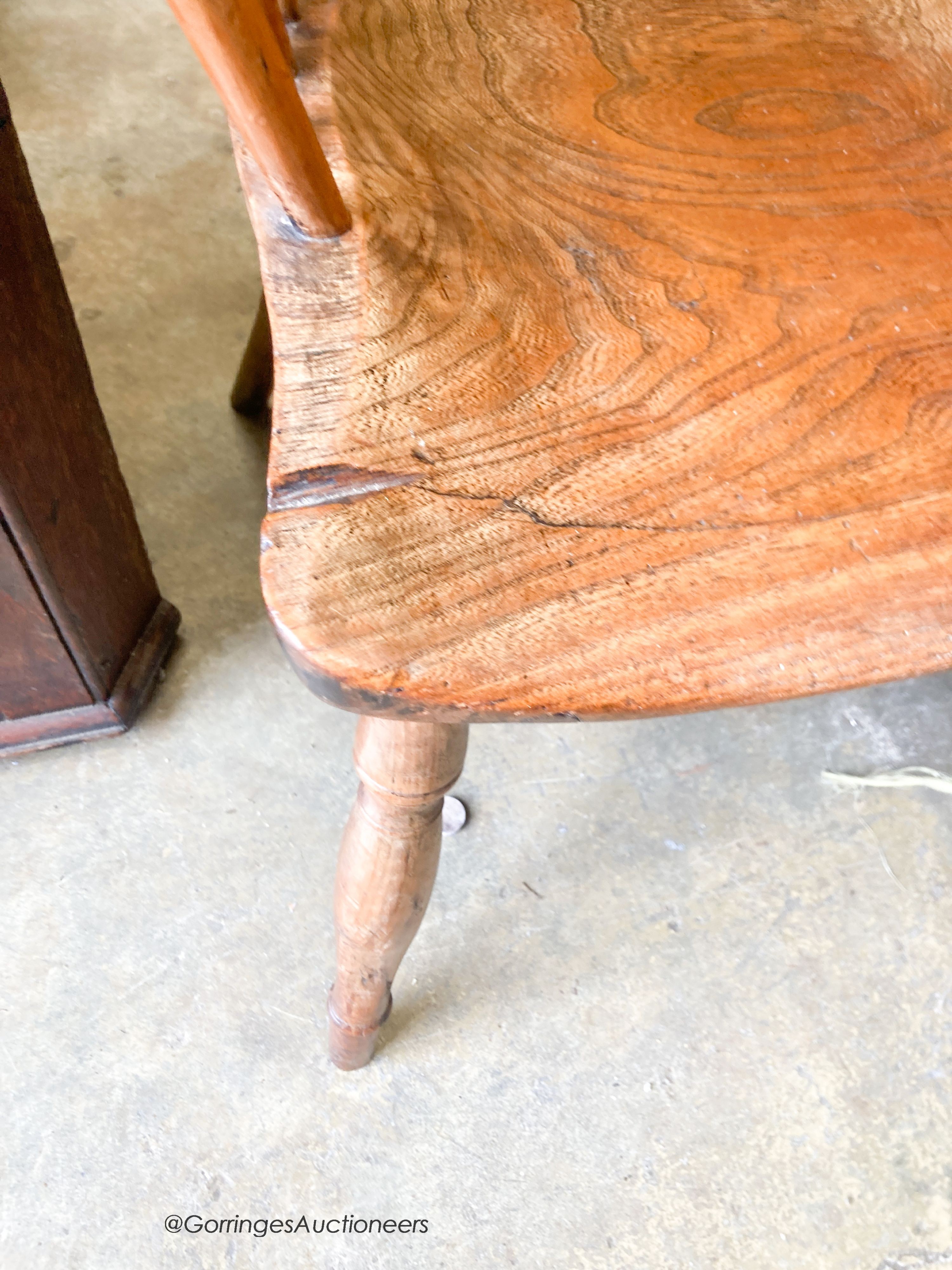 An early 19th century yew and elm Windsor elbow chair, width 59cm, depth 40cm, height 97cm